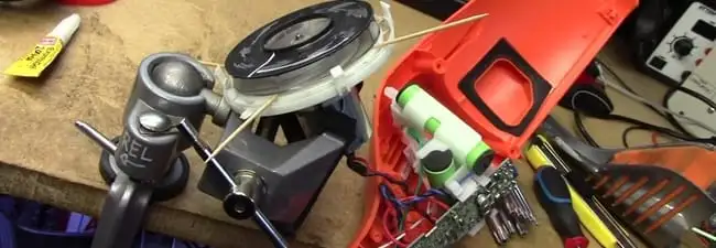 Vacuum cleaner repair parts and tools on a workbench in San Antonio, TX